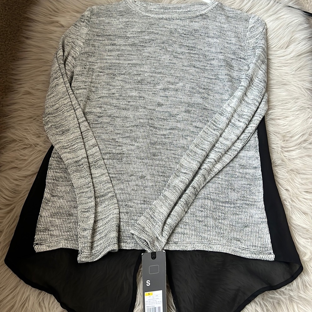 Women’s sweater top with sheer back